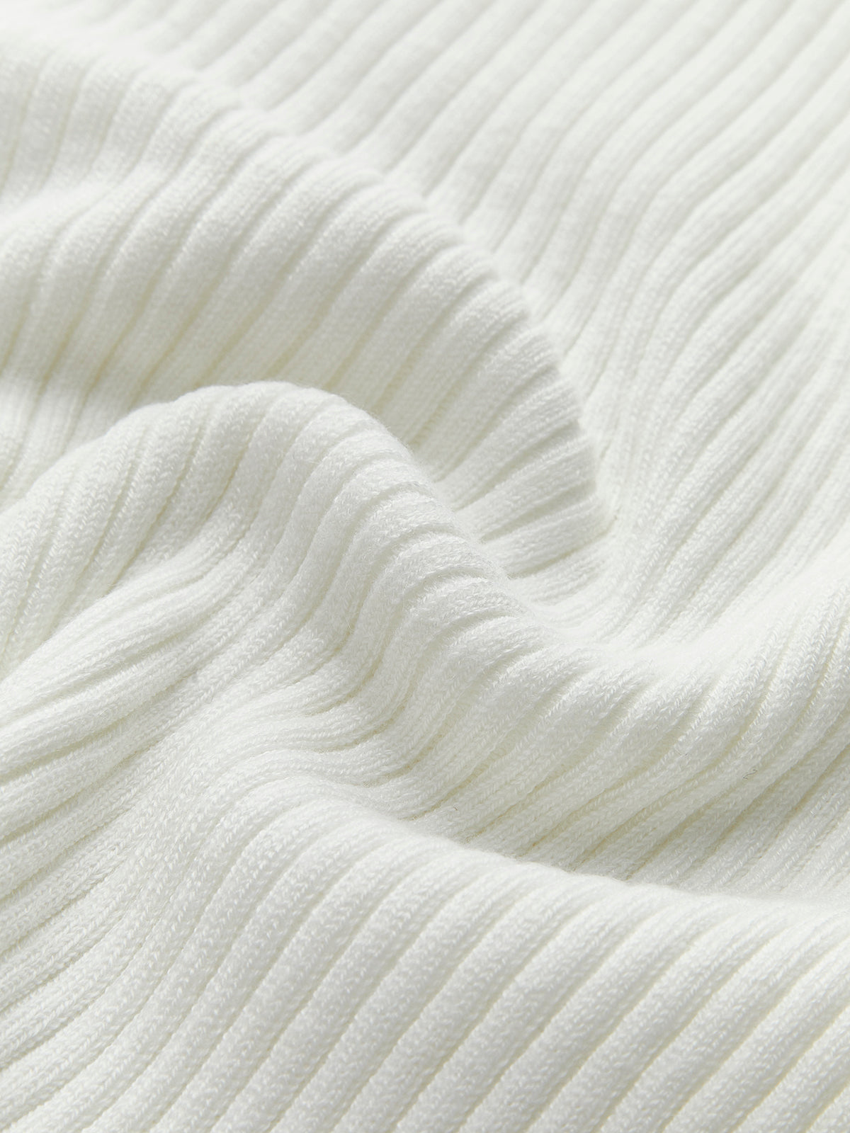 Ribbed Knit Crew Neck Top with Asymmetric Hem